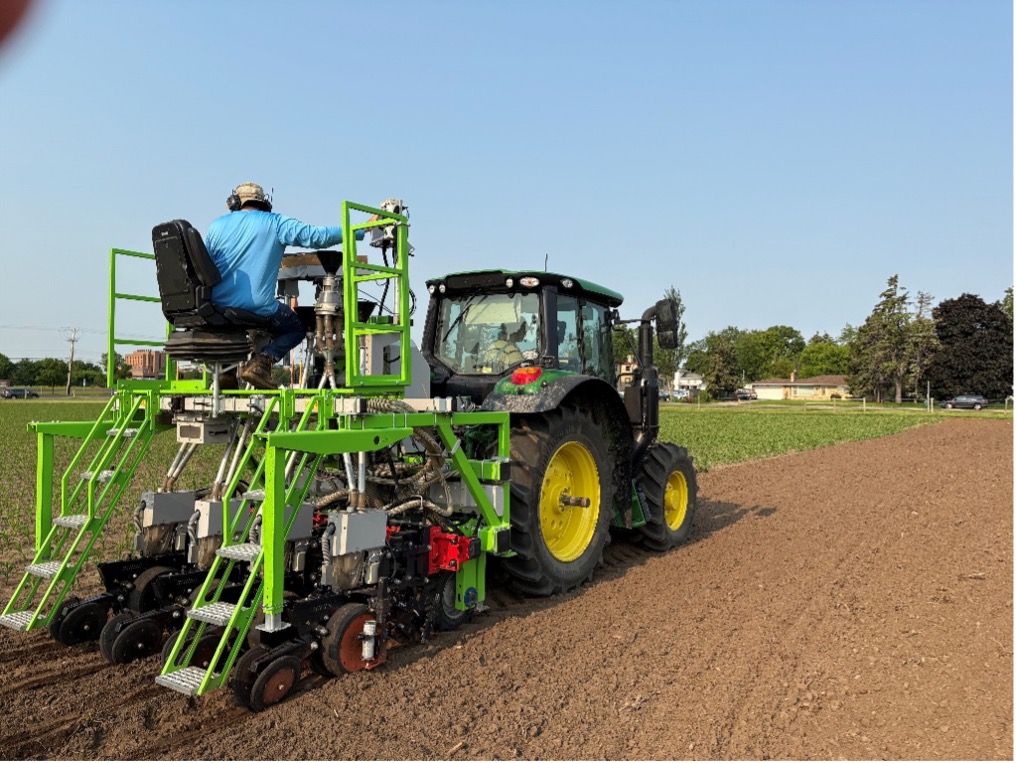 Aaron lorenz on tractor University of Minnesota researcher Aaron Lorenz